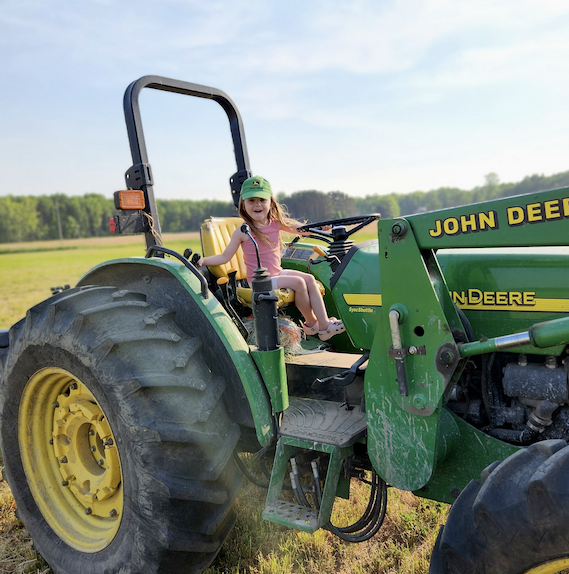 My Daughter on a tractor