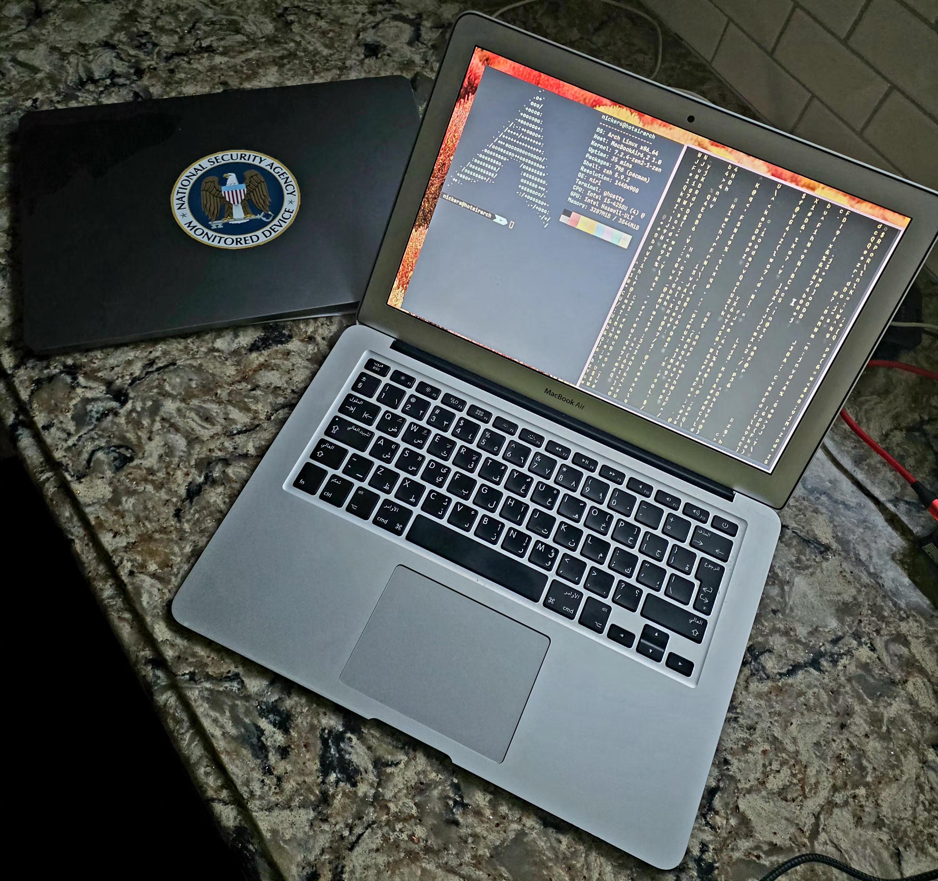2013 MacBook Air running Arch Linux on a granite countertop